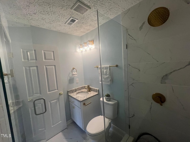 bathroom featuring toilet, a shower with shower door, and vanity