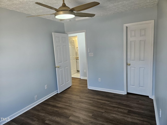 unfurnished bedroom with a textured ceiling, dark hardwood / wood-style floors, and ceiling fan