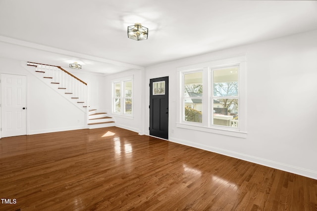 entryway with dark wood-type flooring