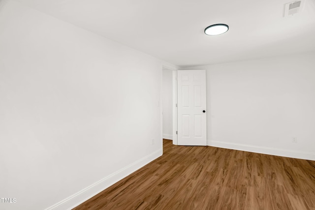 unfurnished room featuring wood-type flooring