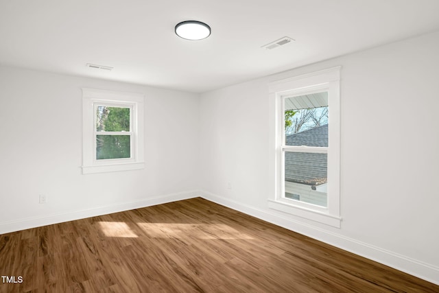 spare room with hardwood / wood-style flooring