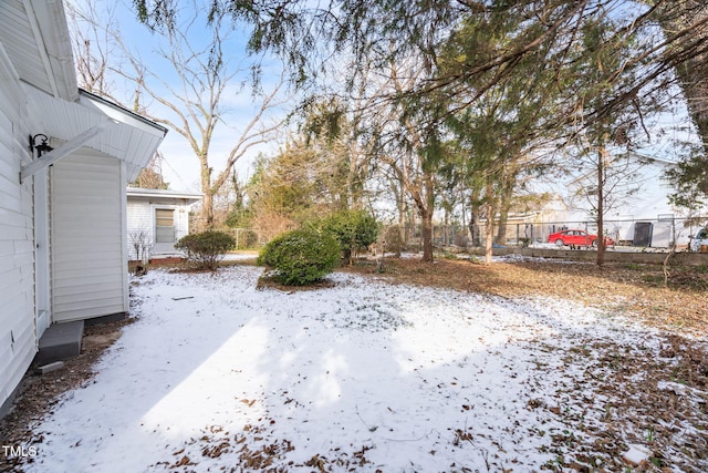 view of yard layered in snow