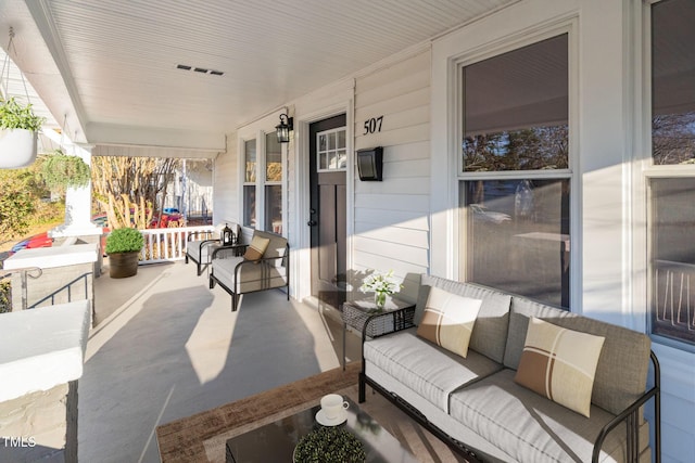 view of patio / terrace featuring a porch and an outdoor living space