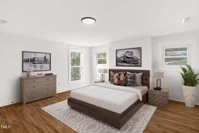 bedroom featuring dark wood-type flooring