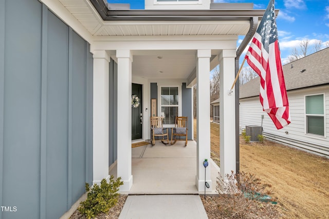 property entrance featuring central AC and covered porch