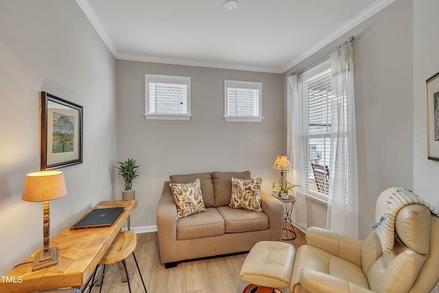 living area featuring crown molding and light hardwood / wood-style floors