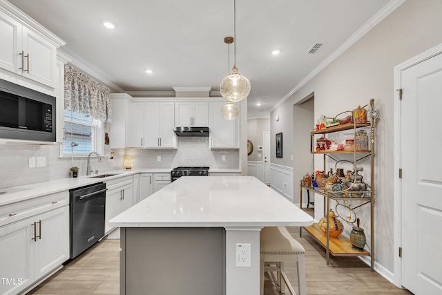 kitchen featuring built in microwave, sink, white cabinets, and dishwasher