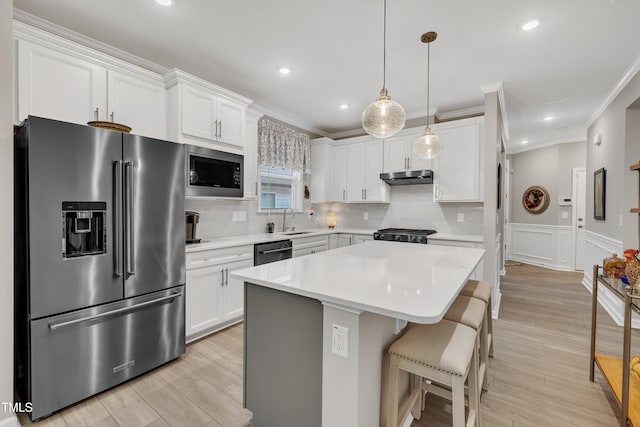 kitchen with sink, high end fridge, white cabinetry, built in microwave, and stainless steel dishwasher