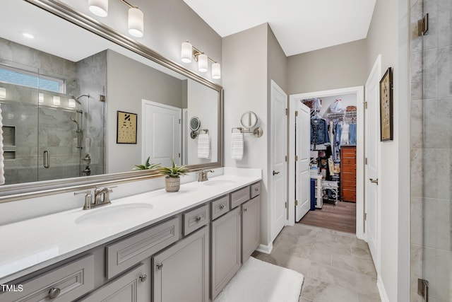 bathroom with vanity and a shower with shower door