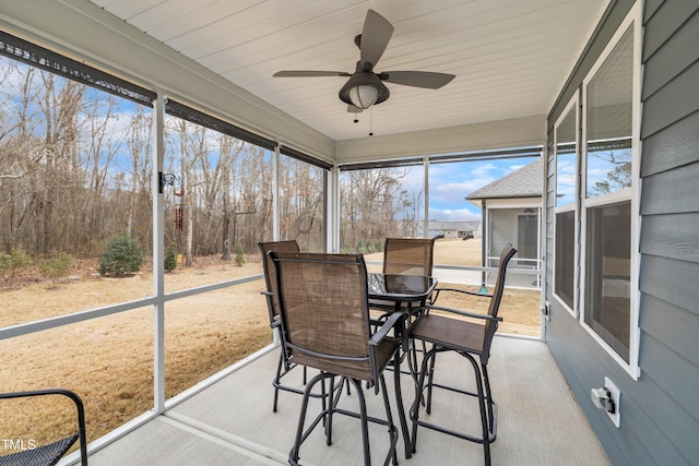 sunroom / solarium with ceiling fan