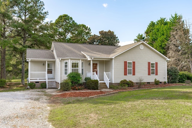 single story home with a front lawn and covered porch