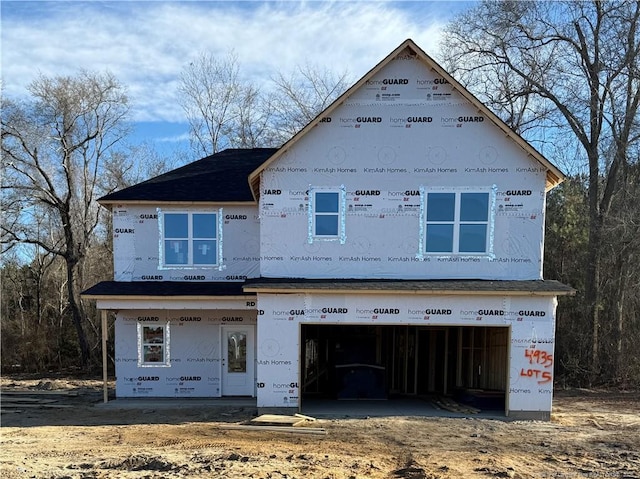 property in mid-construction with an attached garage