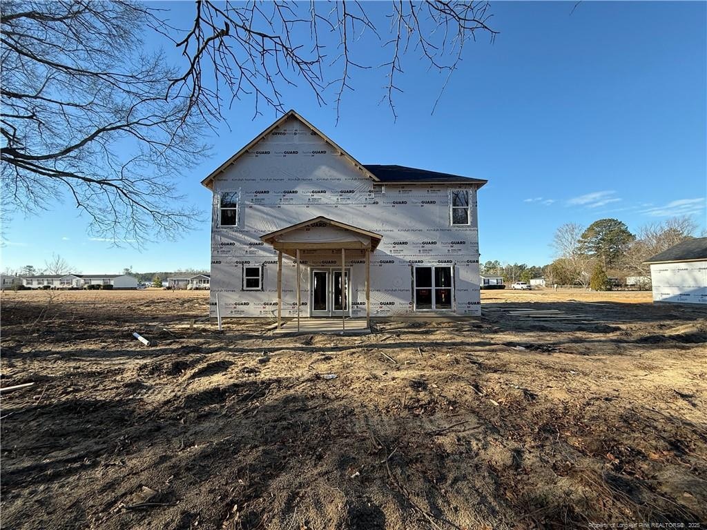 back of house featuring french doors