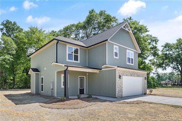 4935 High Branch Ct, Stedman, NC 28391 - view of front of home with roof with shingles, concrete driveway, a garage, and stone siding