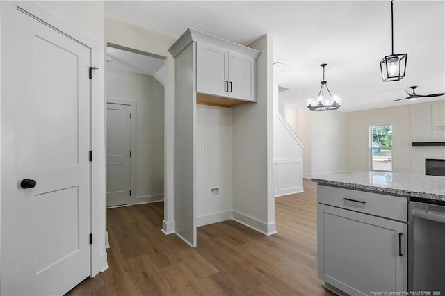 4935 High Branch Ct, Stedman, NC 28391 - kitchen featuring dishwasher, light wood-type flooring, baseboards, and light stone countertops