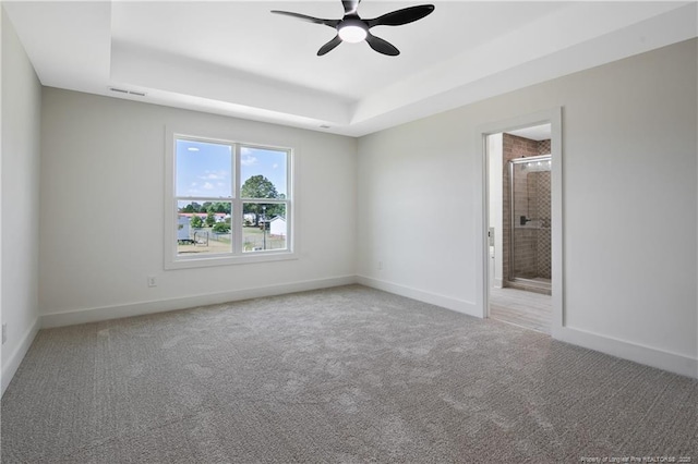 4935 High Branch Ct, Stedman, NC 28391 - spare room with a tray ceiling, baseboards, visible vents, ceiling fan, and light colored carpet