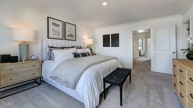 bedroom featuring crown molding and light carpet