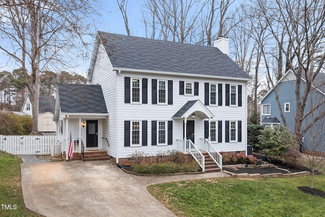 colonial home with a front yard