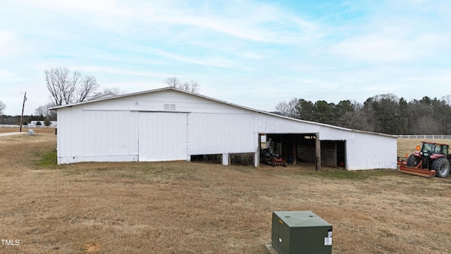 view of outbuilding featuring a yard