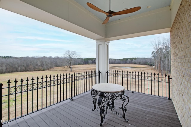 wooden terrace with ceiling fan and a rural view