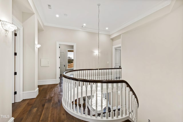 hallway with ornamental molding and dark hardwood / wood-style floors