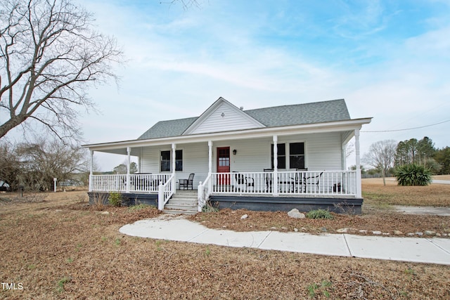 view of front of property with a front yard and a porch