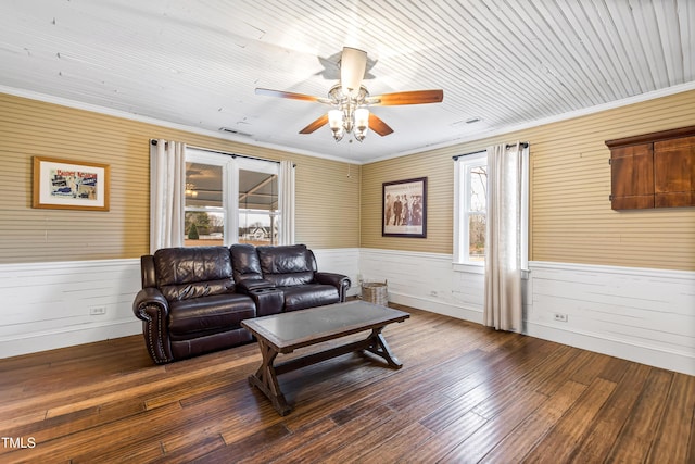 living room featuring ornamental molding, ceiling fan, and dark hardwood / wood-style flooring