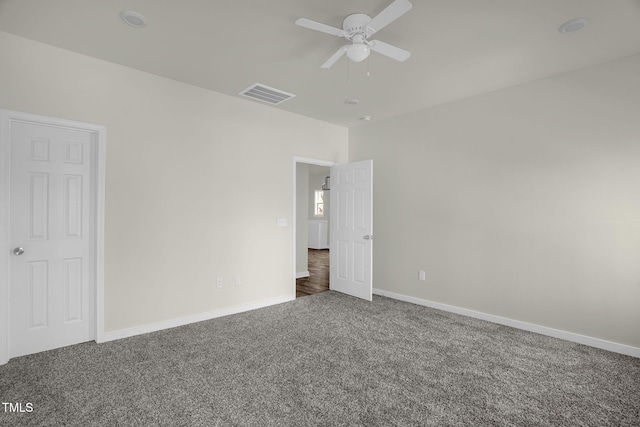 unfurnished bedroom with ceiling fan and carpet