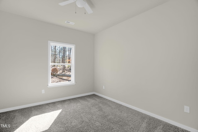 empty room featuring ceiling fan and carpet flooring