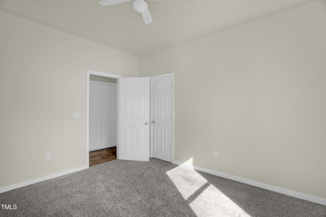 unfurnished bedroom with ceiling fan and carpet flooring