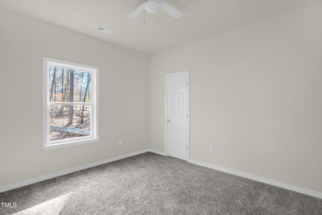 spare room with ceiling fan and carpet flooring