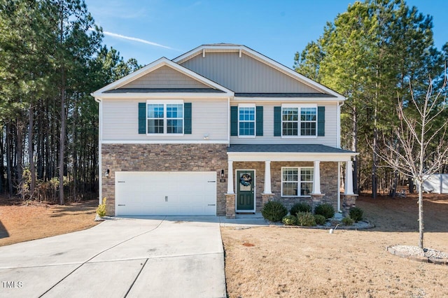 craftsman inspired home featuring a garage and a porch