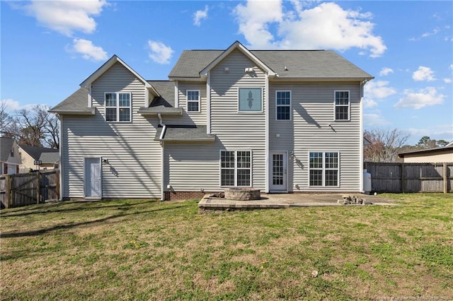 back of property featuring a yard and a patio