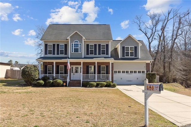 colonial house with brick siding, a front lawn, concrete driveway, covered porch, and an attached garage