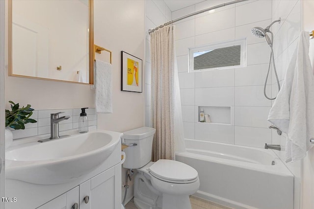 full bathroom with vanity, toilet, shower / bath combo with shower curtain, and backsplash