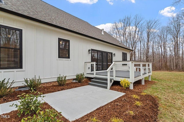 exterior space featuring a wooden deck and a yard