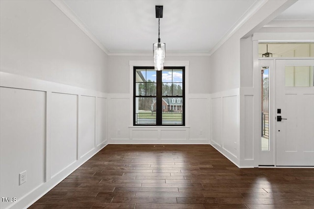 unfurnished dining area with crown molding and dark hardwood / wood-style floors