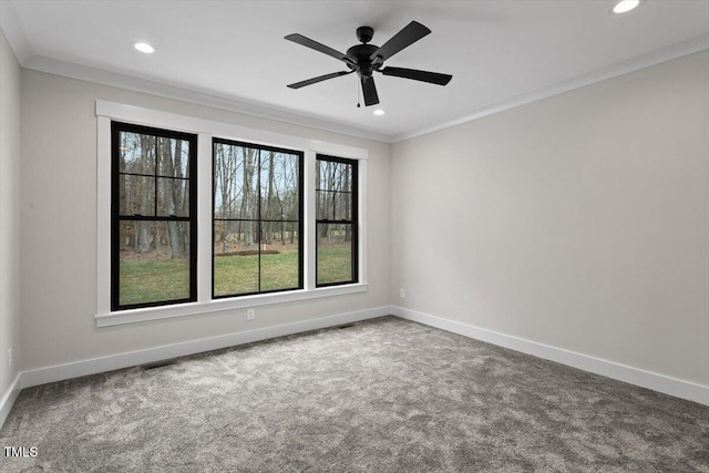 carpeted empty room featuring crown molding and ceiling fan