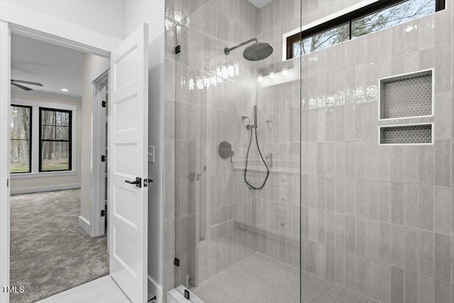 bathroom with tiled shower