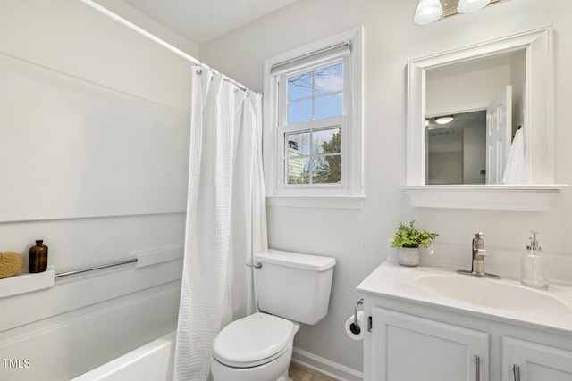 full bathroom featuring vanity, shower / bath combo with shower curtain, and toilet