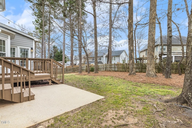 view of yard featuring a deck and a patio area