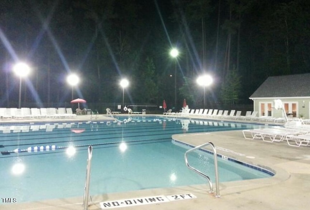 view of swimming pool featuring a patio area