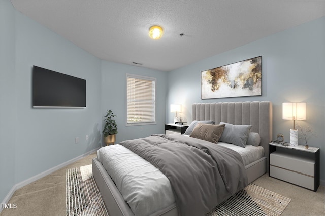 carpeted bedroom with a textured ceiling