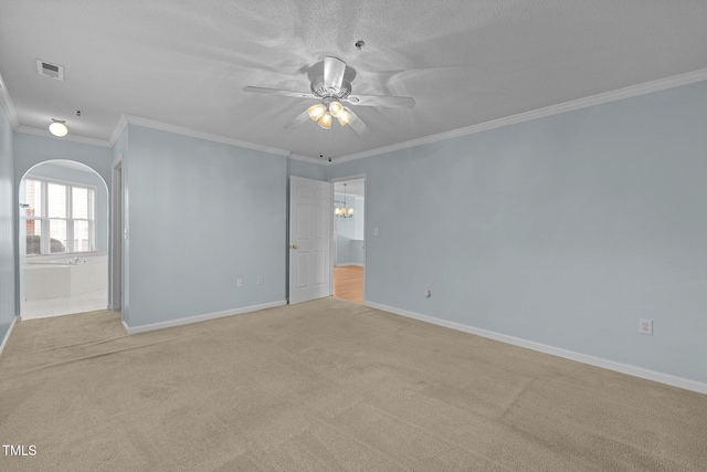 carpeted empty room with crown molding, a textured ceiling, and ceiling fan