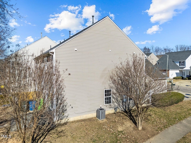 view of home's exterior with central AC