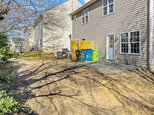 exterior space with fence and a patio