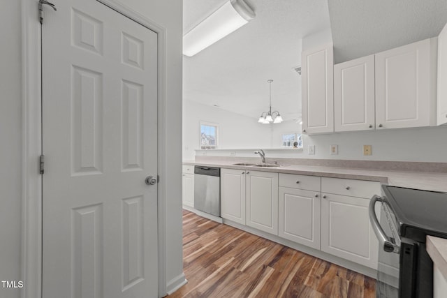 kitchen with pendant lighting, light countertops, electric range oven, white cabinetry, and dishwasher