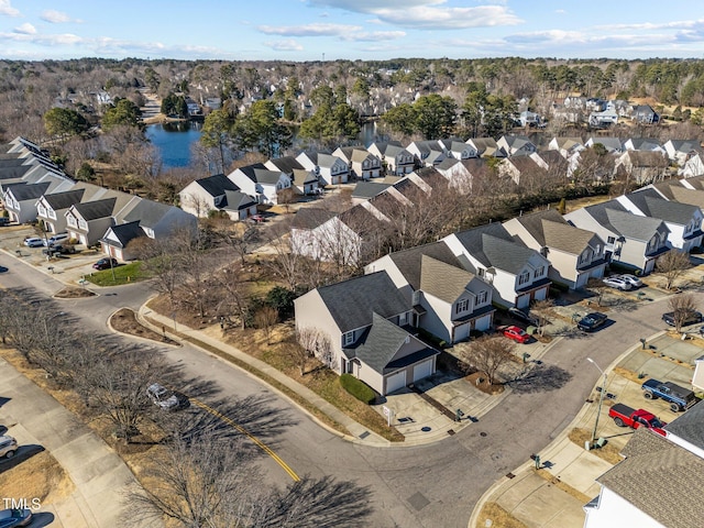 birds eye view of property featuring a residential view and a water view