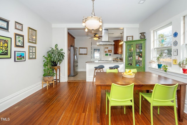 dining area with wood-type flooring