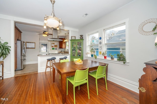 dining room with hardwood / wood-style flooring